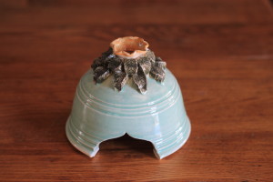 Robin's Egg Blue Toad House with a sweet little flower and leaves adorning the roof! Great abode to place in your garden, pretty and functional! Every toad needs a house!