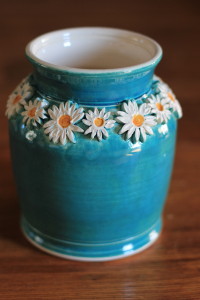 Blue Glaze with white spray of Daisy Flowers around the Vase, White Interior