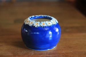 Small Bright Blue Vase Ringed in White Daisy Flowers